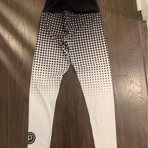 Onzie by Pure Barre brand white and black dotted workout leggings
